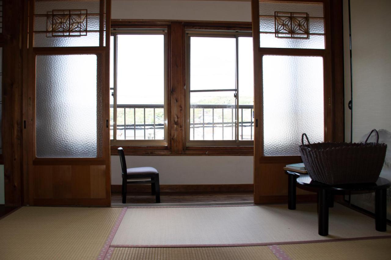 מלון Kamitondacho Guest Cafe Kuchikumano מראה חיצוני תמונה